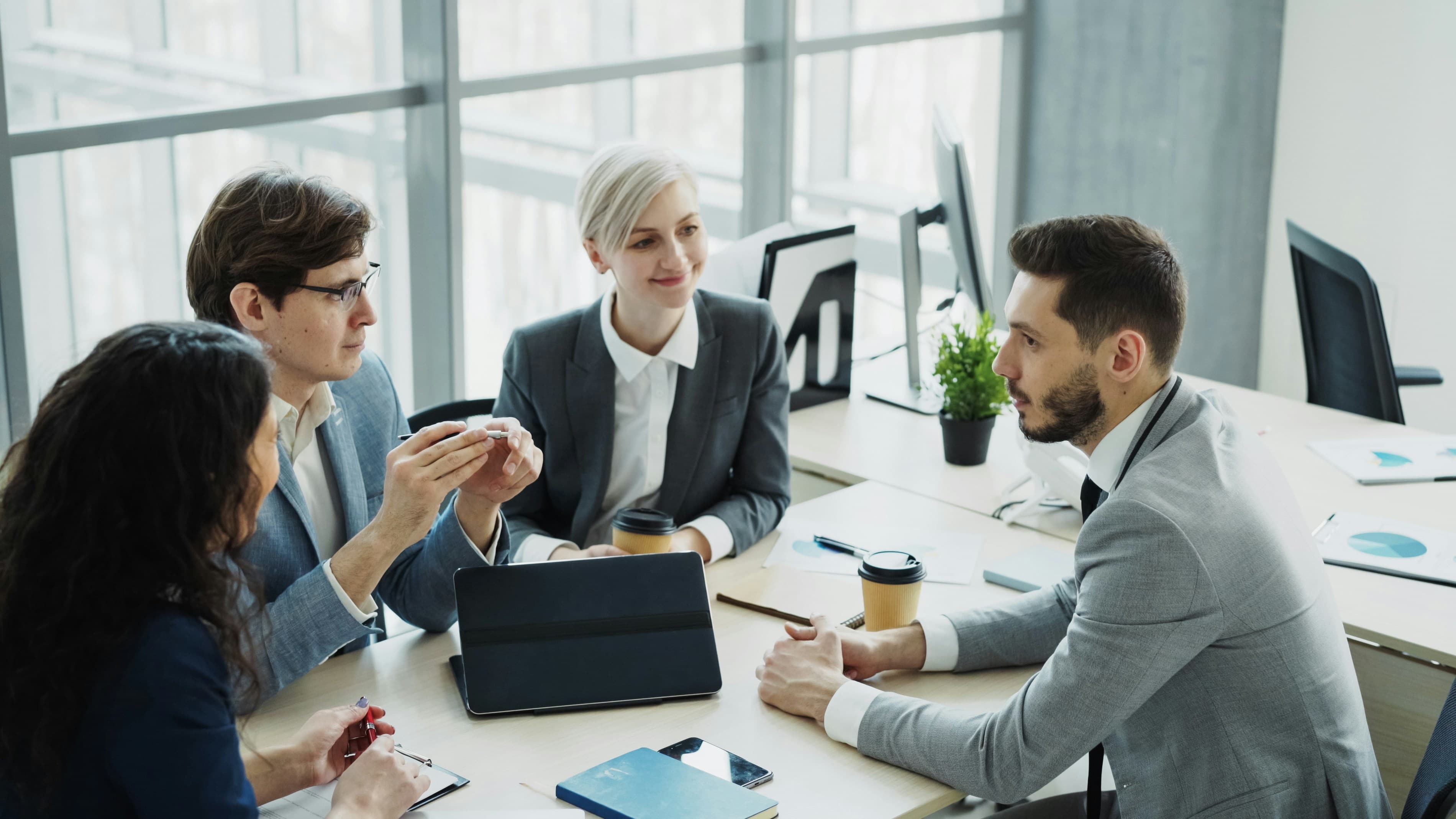 Business owners and advisors in a focused planning conversation