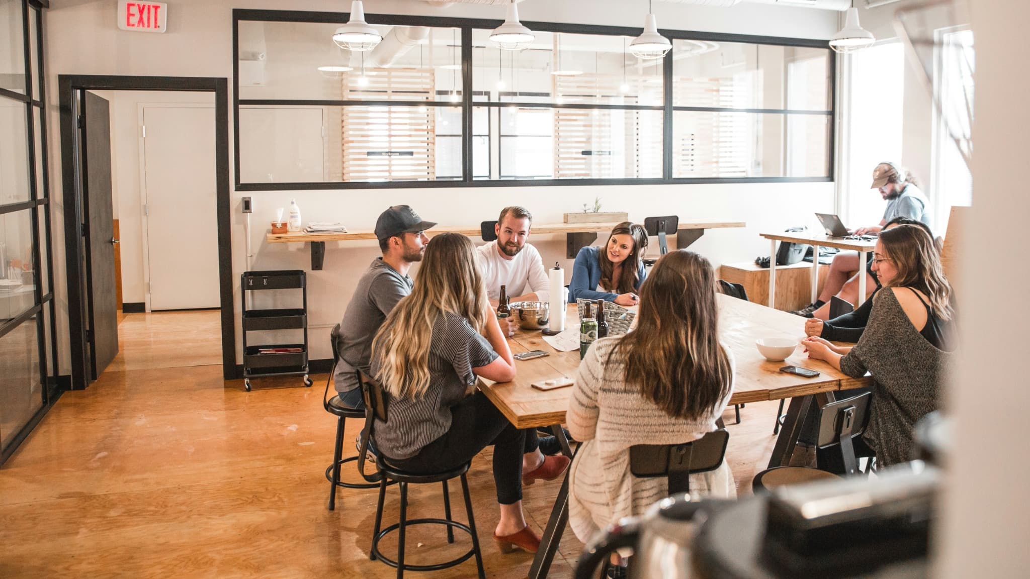 A small business team meeting around a shared table